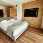 white bed linen on bed